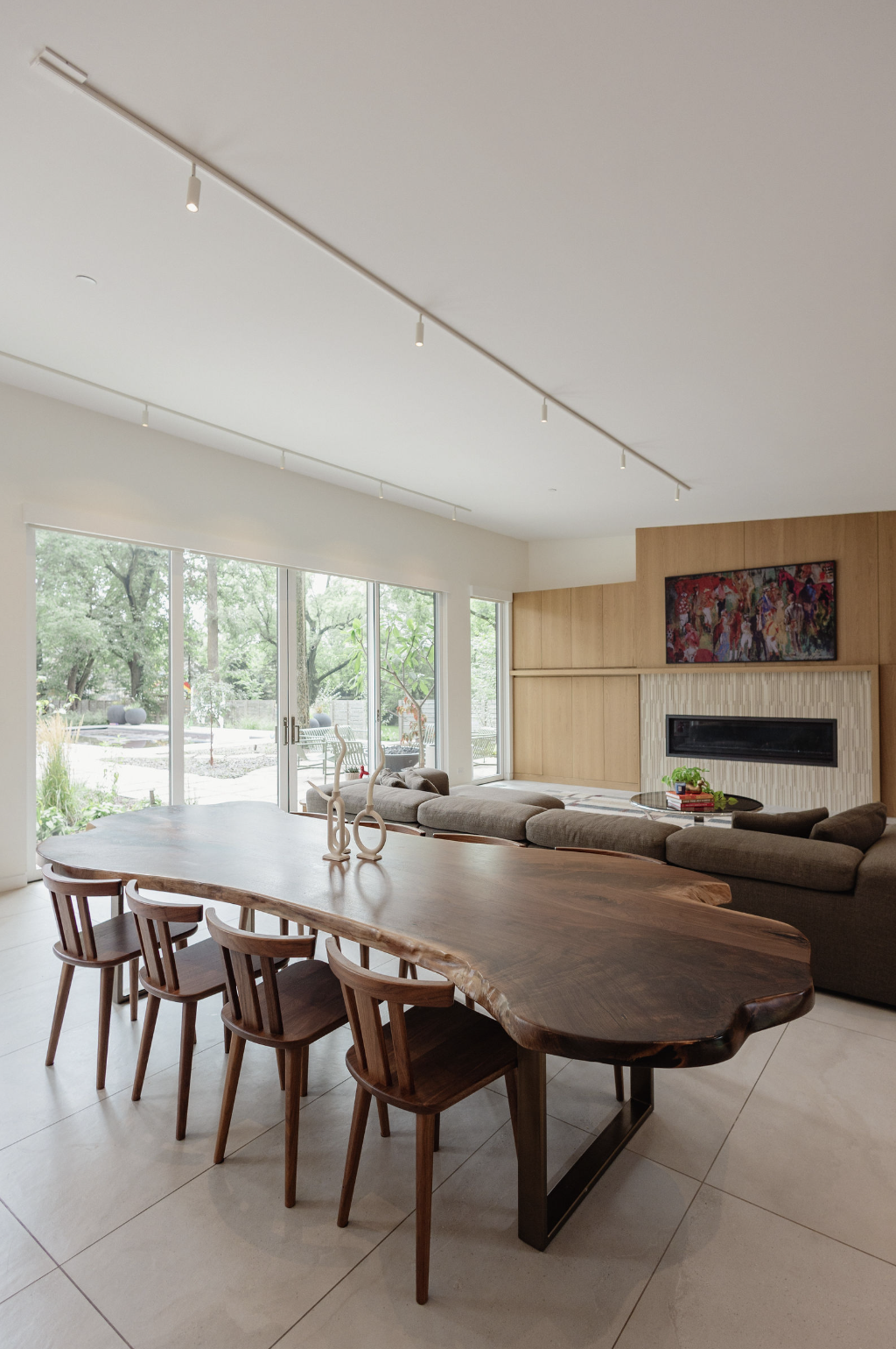 Live-edge dining table with surrounding wood dining chairs